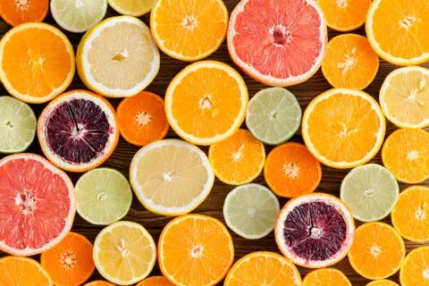 Background texture of mixed cut citrus fruit Stock Photos