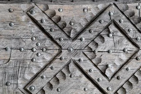 Background texture nails hammered into tree. Nails hats. Stock Photos