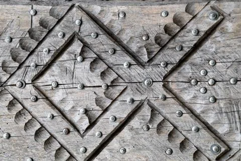 Background texture nails hammered into tree. Nails hats. Stock Photos