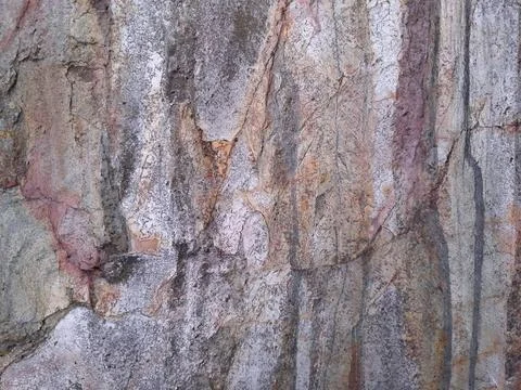 Background texture of natural stone in gray, purple, red colors. Stock Photos