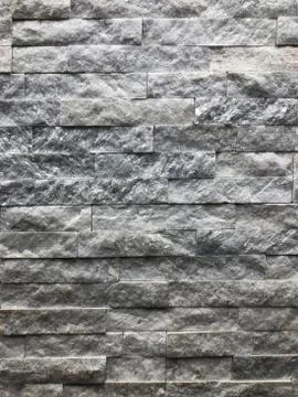 Background, texture of an old brick gray-brown color. Used for walls Stock Photos