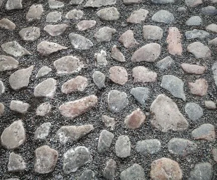 Background texture of old cobblestone road surface Stock Photos