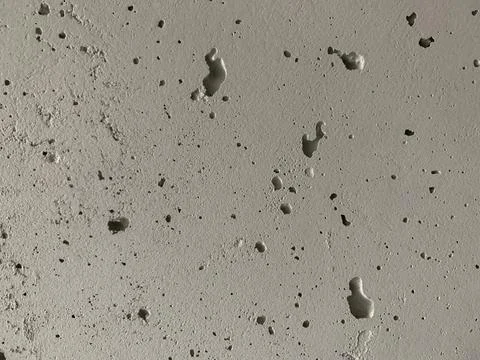 Background texture: old concrete wall. Wall with small holes and gray crack.. Stock Photos