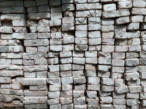 Background texture: old, damaged brick wall. Shabby building facade with whit Stock Photos