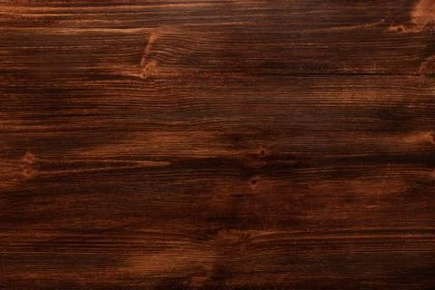 Background texture of old dark brown wood with defects Stock Photos