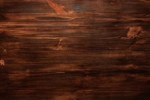 Background texture of old dark brown wood with defects Stock Photos