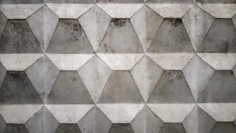 Background texture of an old gray concrete fence with a square pattern. Concr Stock Photos