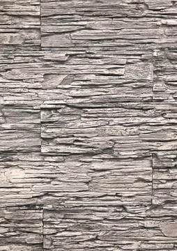 Background, texture of the old ragged stone gray-brown color. Used for walls Foto stock