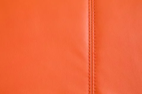 Background texture of Orange artificial leather Stock Photos