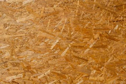 Background texture of OSB panel from pressed plywood. Stock Photos