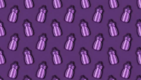 Background texture pattern with purple plastic bottles with dishwashing liqui Stock Photos