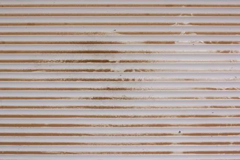 Background texture of plastic blinds covered with dust and dirt. Stock Photos
