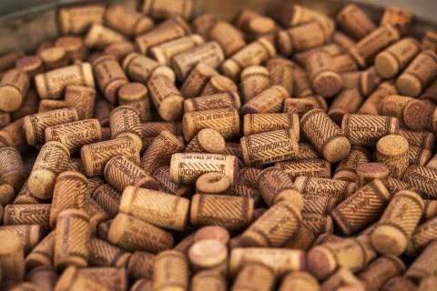 Background texture of a randomly scattered pile of assorted used wine corks with Stock Photos