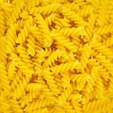 Background the texture of raw pasta closeup Stock Photos
