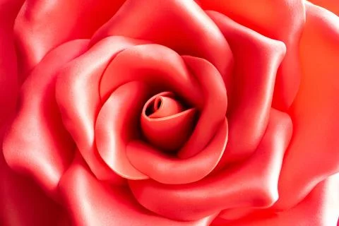 Background texture of a red artificial rose. Artificial red rose bud close-up Foto stock