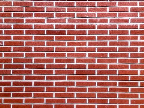 Background texture. Red brick wall with white seams Stock Photos