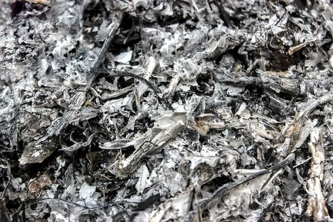 Background texture of the remains of burning garbage. Stock Photos