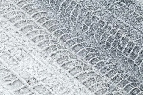 Background texture of road covered with snow and tire tracks Stock Photos