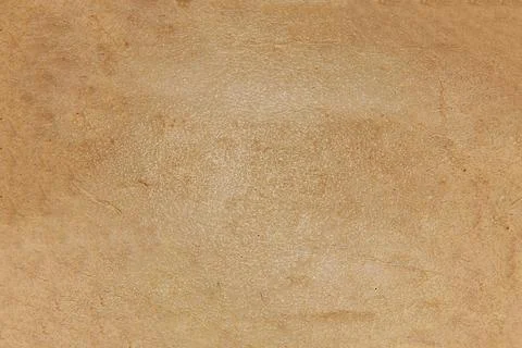 The background texture is a rough brown glossy surface with streaks and spo.. Stock Photos