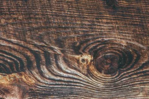 Background texture of rough surfaced wood showing knots and rings Stock Photos