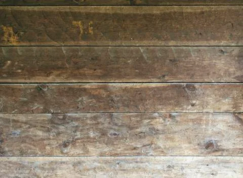 Background texture of rough surfaced wood siding on country structure Stock Photos