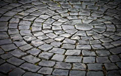 Background texture of round cobblestone pavement square Stock Photos