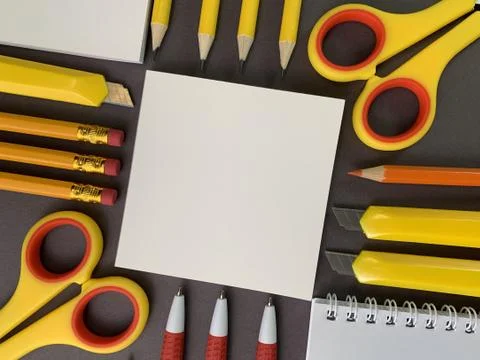 Background texture: school stationery on the desk, yellow and orange. Station Stock Photos