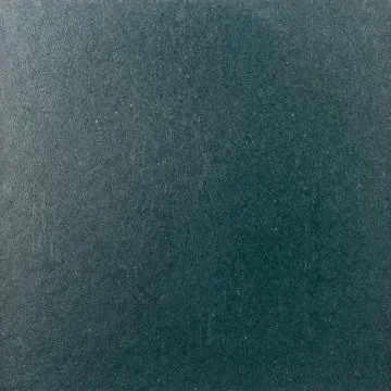 Background texture of a shiny metal sheet with a rough stippled textured surf Foto stock