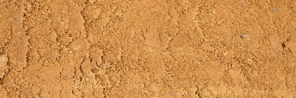 Background texture from the smooth surface of the sand. top view. banner Stock Photos