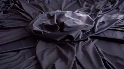 A background texture of soft black fabric textile material reverse moving. Stock Footage 87710946