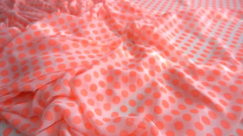 A background texture of soft orange dotted fabric textile material reverse Stock Footage 87711962