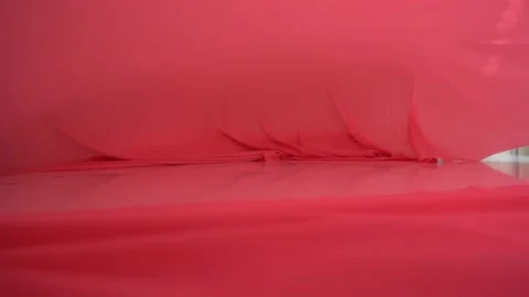 A background texture of soft red fabric textile material reverse moving. Stock Footage 87715056