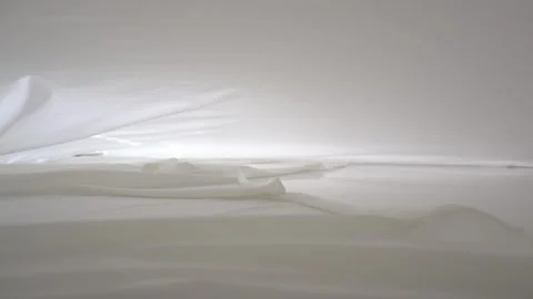 A background texture of soft white fabric textile material wave moving. Stock Footage 87715436