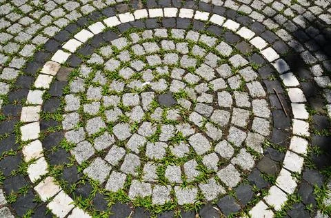 Background, texture. Square cut stones are laid out in a pattern. Stock Photos
