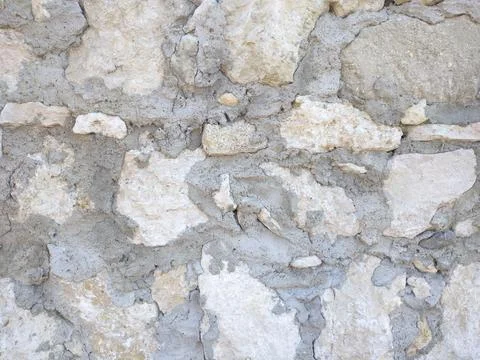 Background texture of stone slabs of pavement or wall Stock Photos