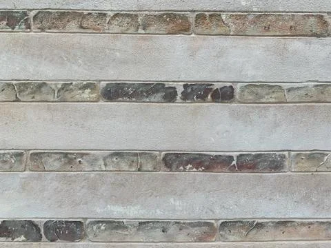 Background texture: stone wall of the building. Painted brick and concrete wa Stock Photos