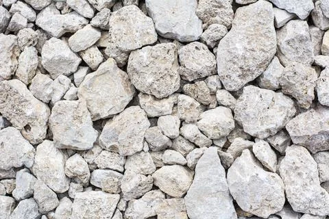 Background, texture of stones. A close-up of rubble. Stock Photos