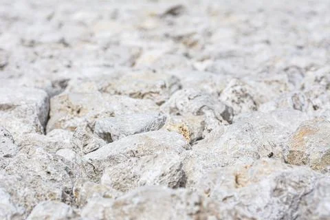 Background, texture of stones. A close-up of rubble. Stock Photos