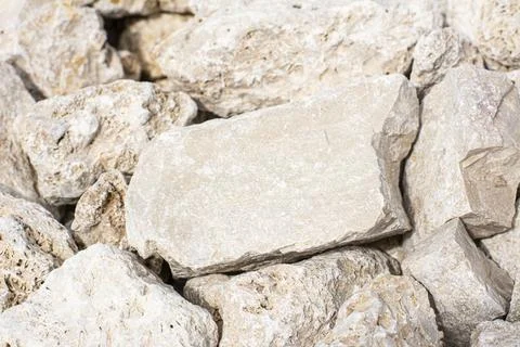 Background, texture of stones. A close-up of rubble. Stock Photos