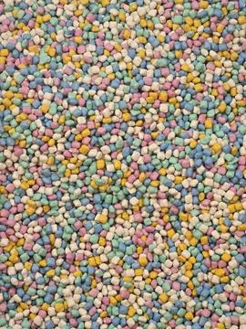 Background texture of tiny colorful candy sprinkles. Stock Photos