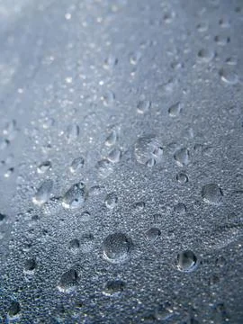 Background texture of water drops and droplets on a glass surface Stock Photos