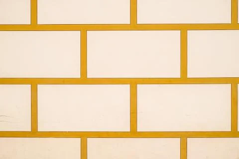Background texture white bricks and yellow cement. Masonry of stone. Foto stock