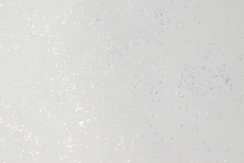 Background texture of white paper with glitter. Stock Photos