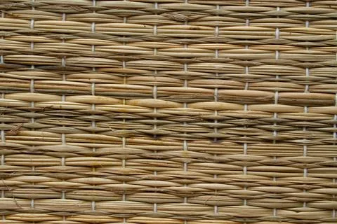 Background texture wicker light yellow straw closeup Stock Photos