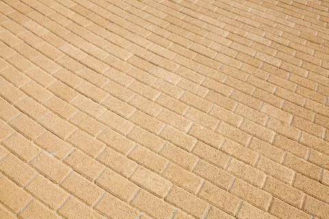 Background texture of yellow cobblestone pavement pattern Foto stock