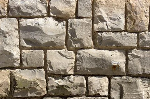 Background of textured stone blocks on a wall Stock Photos