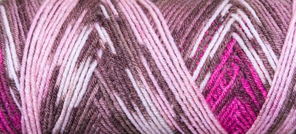 Background thread for knitting. Knitting pattern of colorful yarn wool. Stock Photos