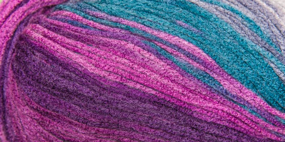 Background thread for knitting. Knitting pattern of colorful yarn wool. Stock Photos
