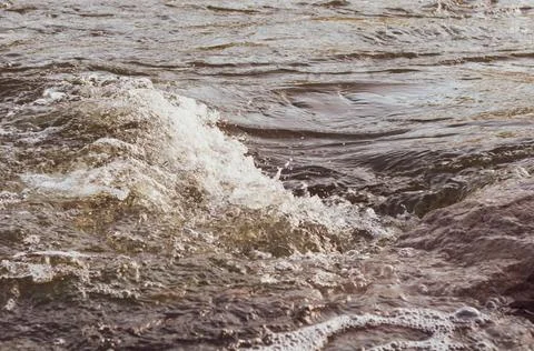 Background, top view, rapid flow river with dark blue water and white foam wa Stock Photos