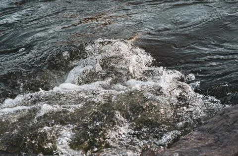 Background, top view, rapid flow of the river with dark blue water and white  Stock Photos